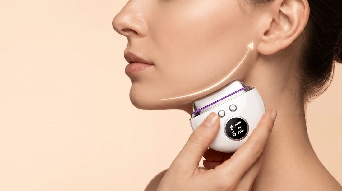 Woman using the REVITALIZE PRO EMS face massager to sculpt and define her jawline.
