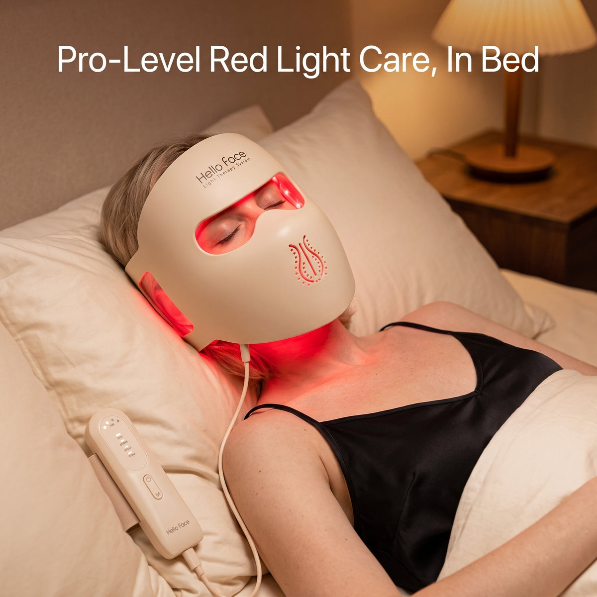 Person lying in bed wearing the ELEVAURE 4D Contoured LED Face Mask in Red 630nm mode during a relaxed evening anti-aging session, demonstrating hands-free red light therapy for fine lines and skin firmness.