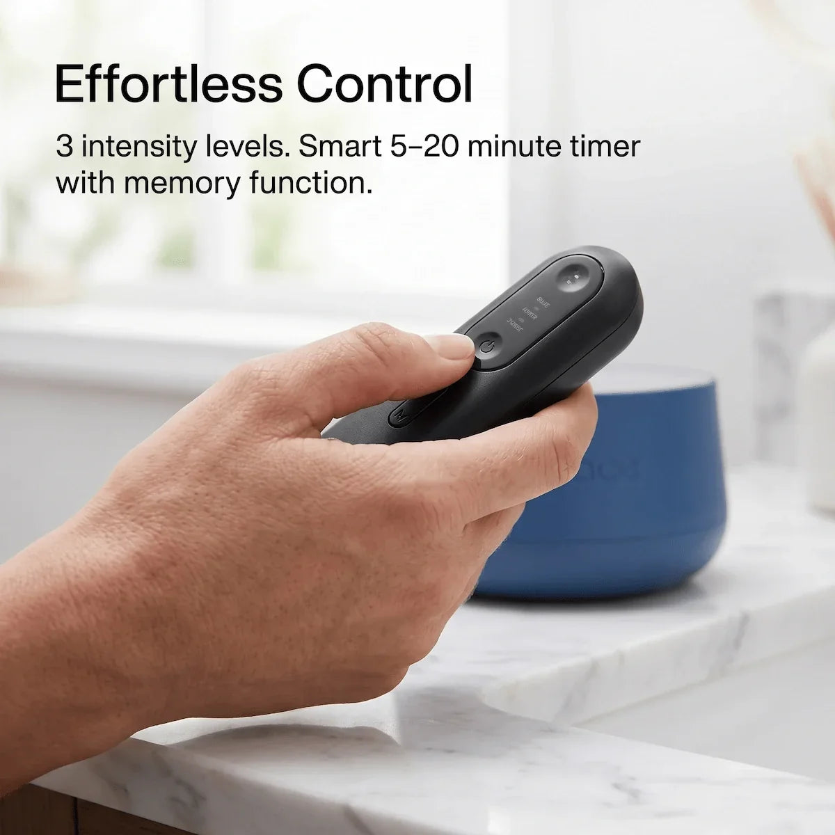 Handheld remote controller of the Elevaure LED wrap showing buttons and timer display.