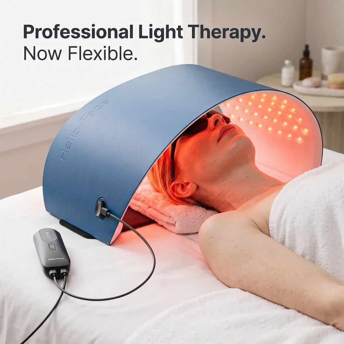 Woman reclining comfortably at home using the Elevaure flexible LED light therapy wrap over her face.