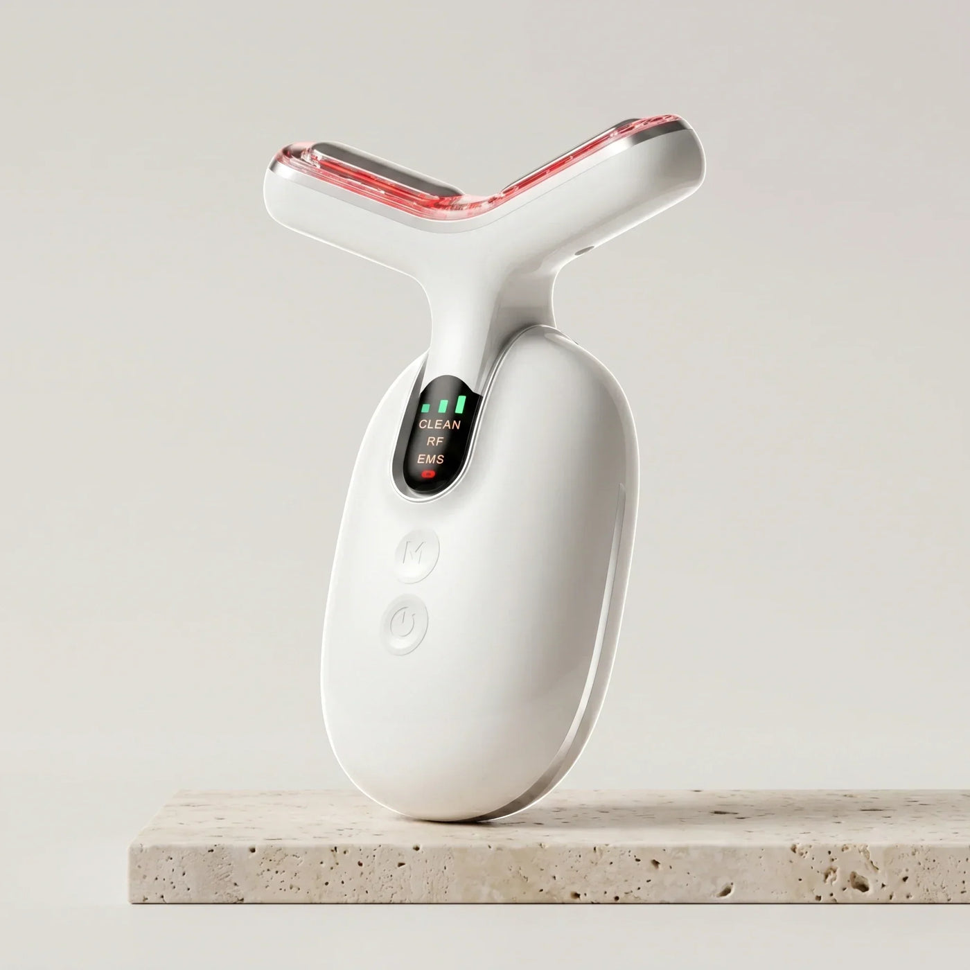At-home neckline tightening tool — ELEVAURE RF EMS LED neck care device in Pearl White on clean background.