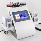 Front-angled view of the complete 6-in-1 professional body contouring system, showcasing the main console and specialized attachments.