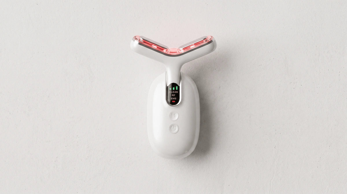 Minimalist overhead view of the Elevaure at-home neck toning device.