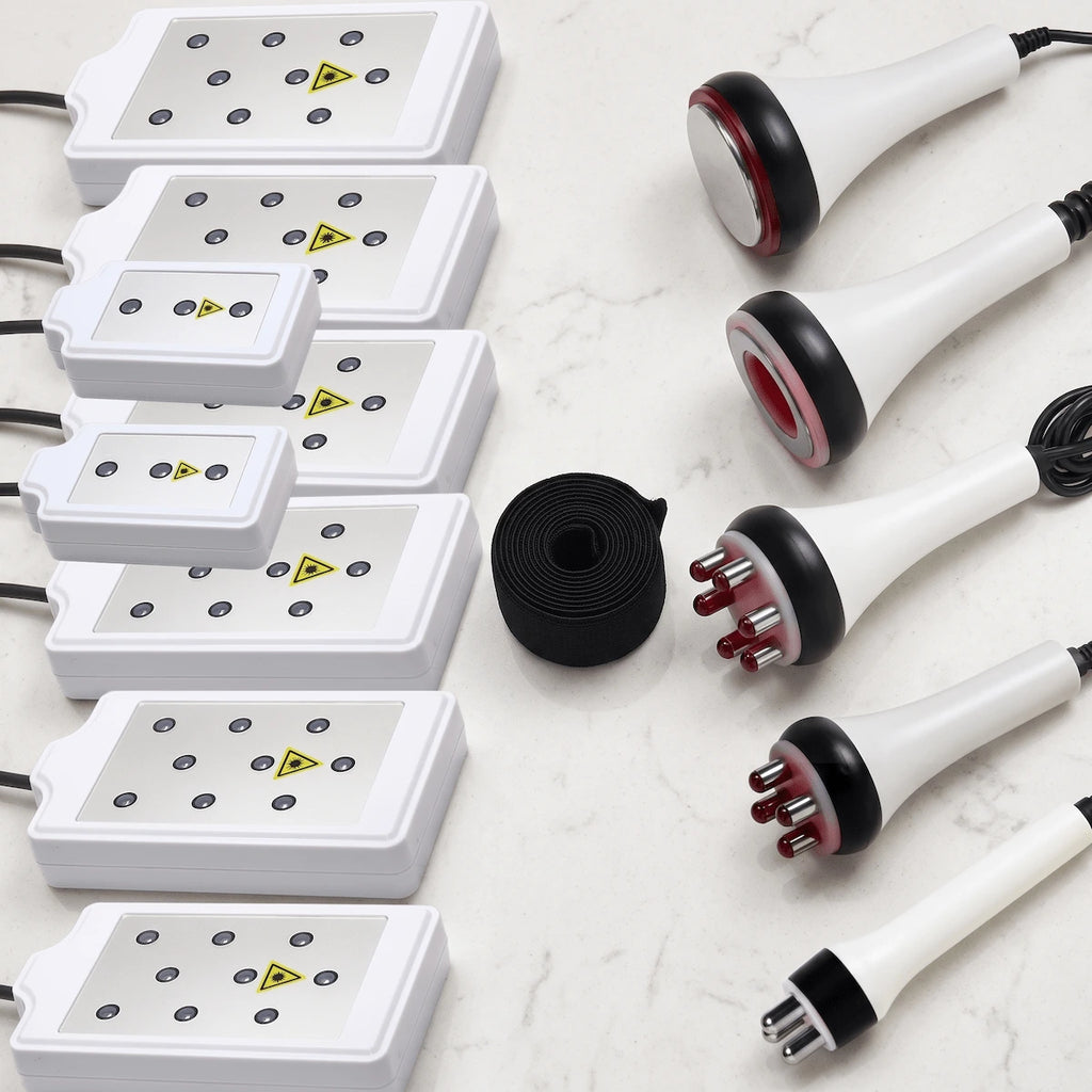 Flat lay presentation of all 6-in-1 system attachments, including 8 LLLT pads, RF probes, cavitation head, and vacuum handle.