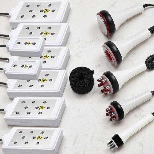 Flat lay presentation of all 6-in-1 system attachments, including 8 LLLT pads, RF probes, cavitation head, and vacuum handle.