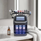 ELEVAURE 10-in-1 Facial Care Machine resting on a luxury modern master bathroom marble countertop during morning skincare routine