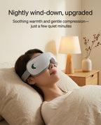 Woman using elevaure heated eye massager at night in bedroom