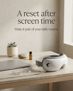 elevaure eye massager on desk next to laptop and glasses