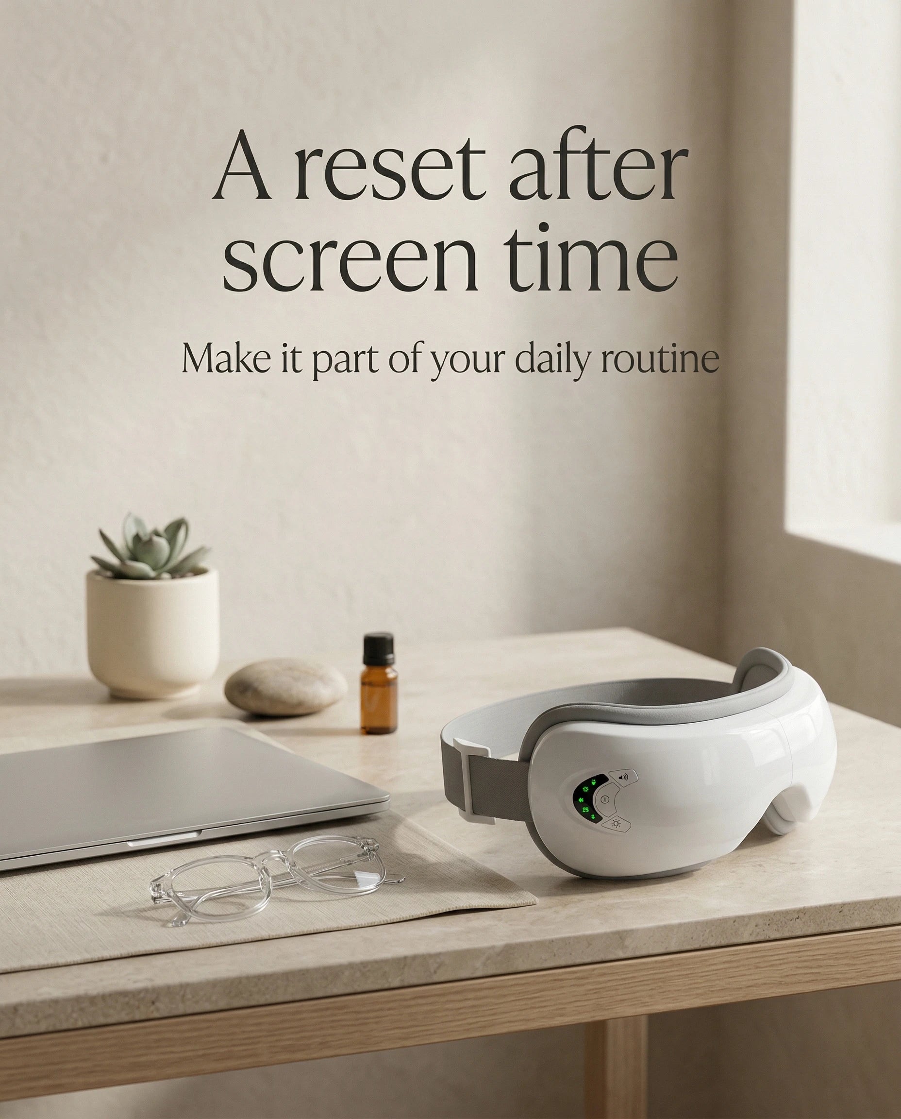 elevaure eye massager on desk next to laptop and glasses