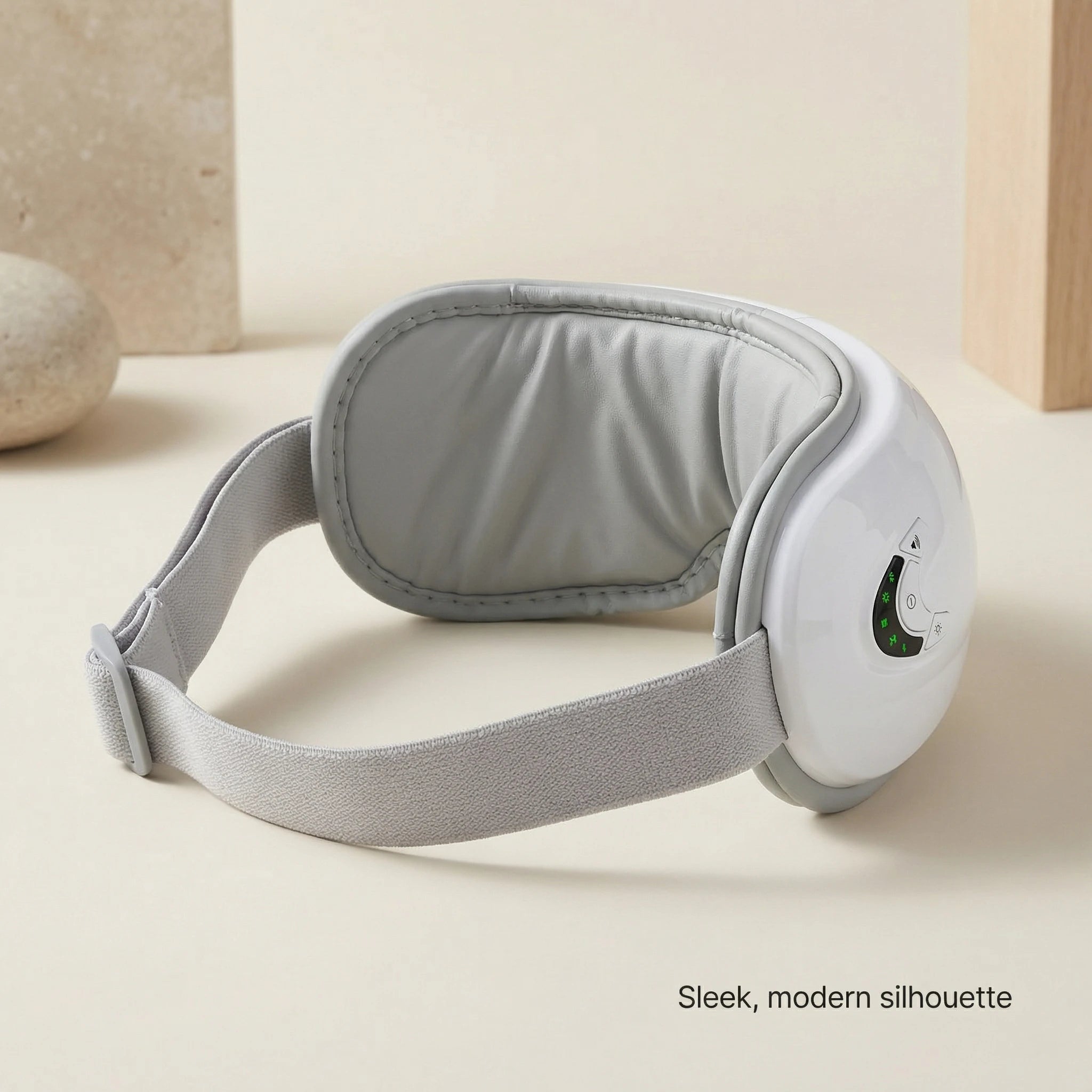Side view of elevaure heated eye massager with adjustable strap
