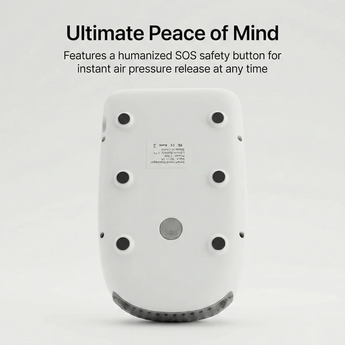 The bottom view of the Elevaure hand massager showcasing the humanized SOS safety button for instant air pressure release.