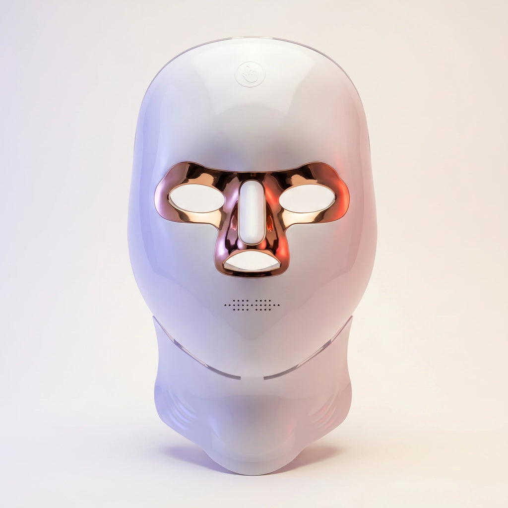 White minimalist LED light therapy mask for face and neck by Elevaure, featuring rose gold accents, intuitive touch sensor, and functional ventilation grid.