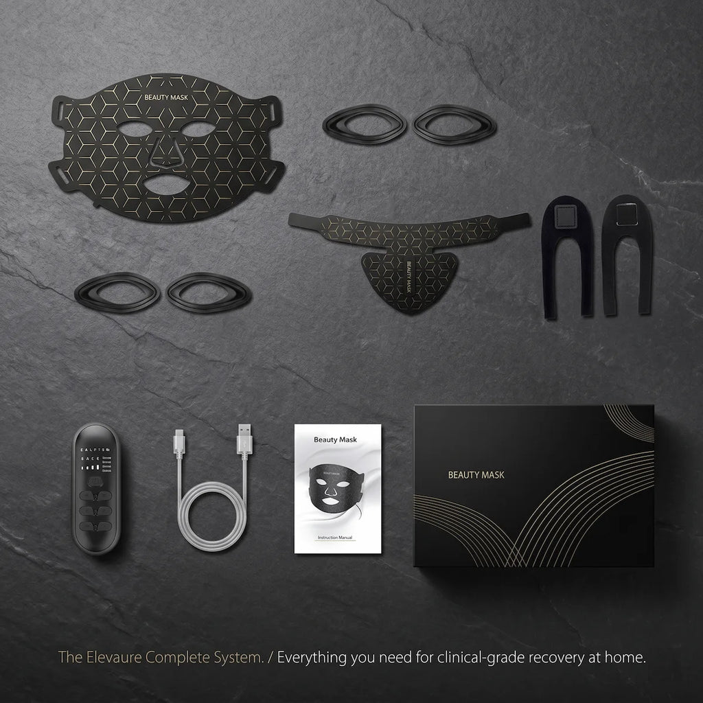 A neat flat lay display of the complete Elevaure LED therapy system, including the face mask, neck piece, controller, straps, and charging cable.