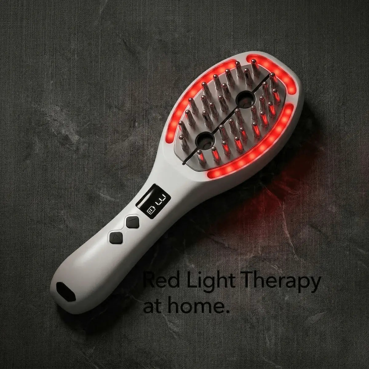 Elevaure scalp massage comb overhead view with red LED phototherapy lights glowing — at-home red light therapy