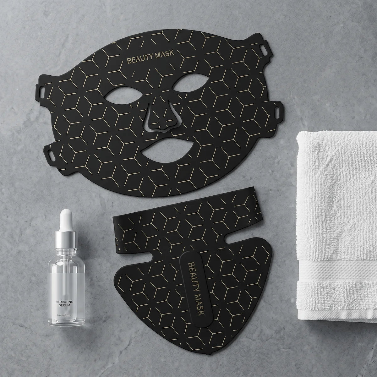 ELEVAURE black LED light therapy mask pieces laid out neatly with a hyaluronic acid serum and a white towel.