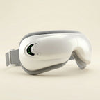 Pearl White elevaure smart heated eye massager with adjustable strap