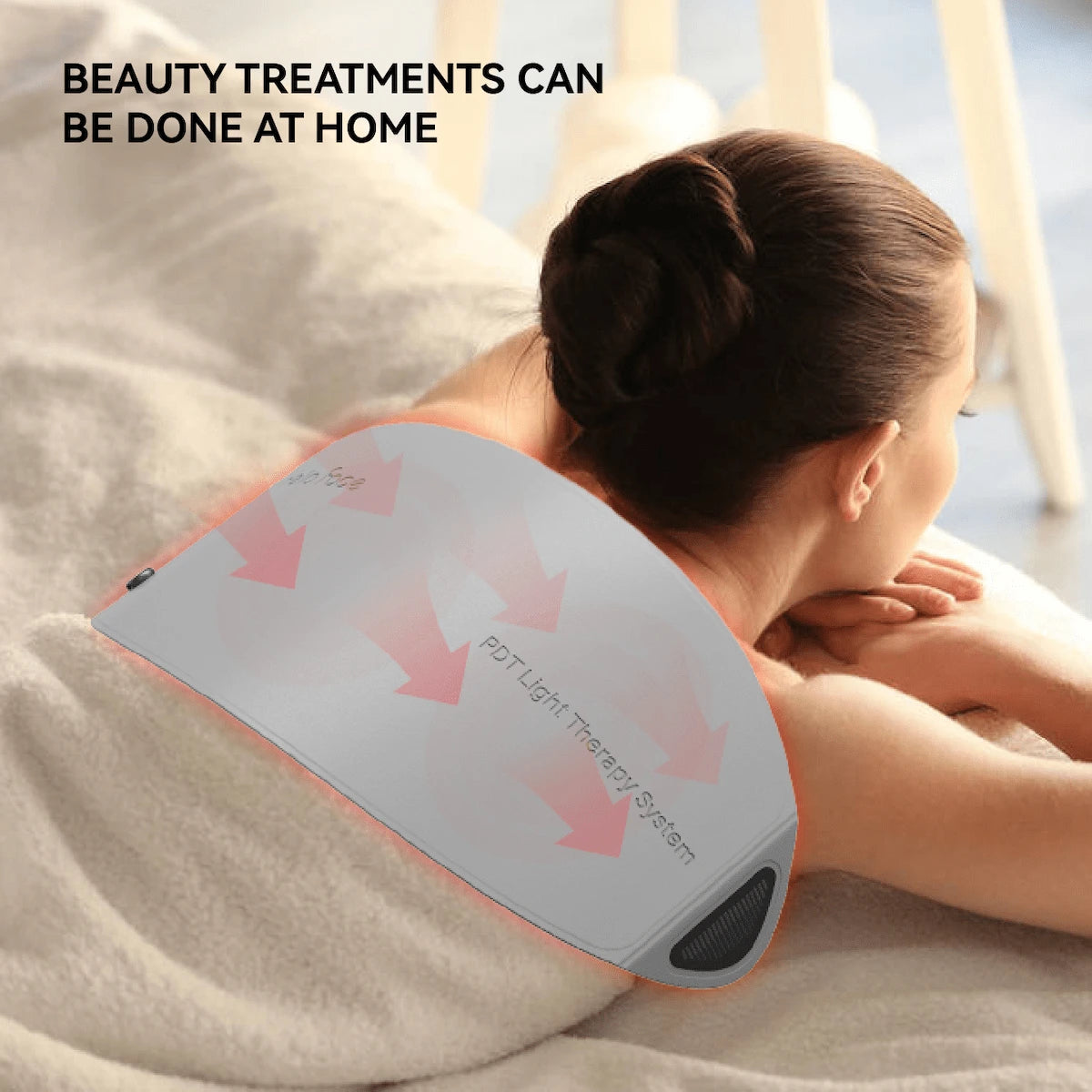 Woman resting prone with the flexible LED light therapy wrap contoured over the upper back and shoulders.