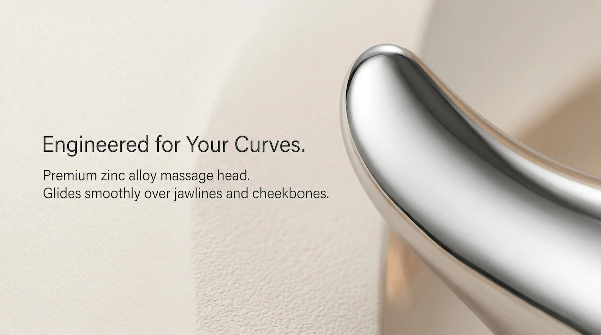 Premium zinc alloy massage head close-up — ergonomic facial contour tool that glides smoothly over jawlines and cheekbones