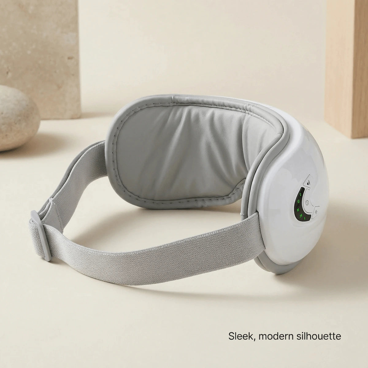 Rear view of a wearable eye massager showing the adjustable strap.