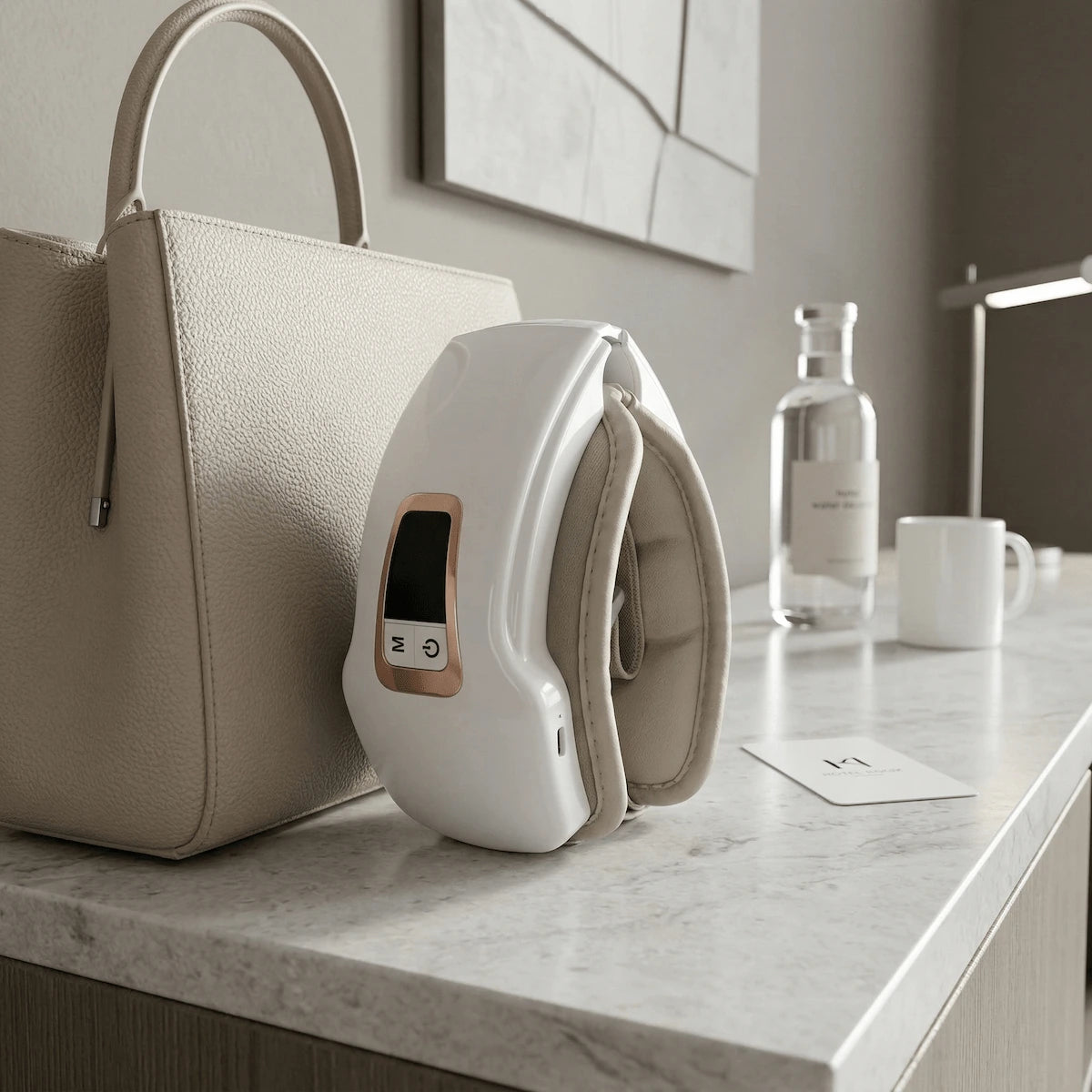 White smart eye massager folded perfectly in half at 180 degrees, demonstrating its compact structure.