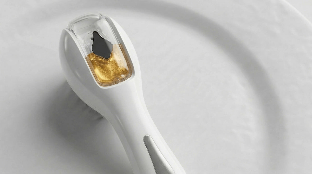 Elevaure micro-mist hair oil applicator brush close-up — serum delivery directly to scalp roots