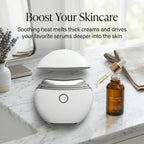 Elevaure Heated Gua Sha Massager used with facial oil as part of a skincare routine