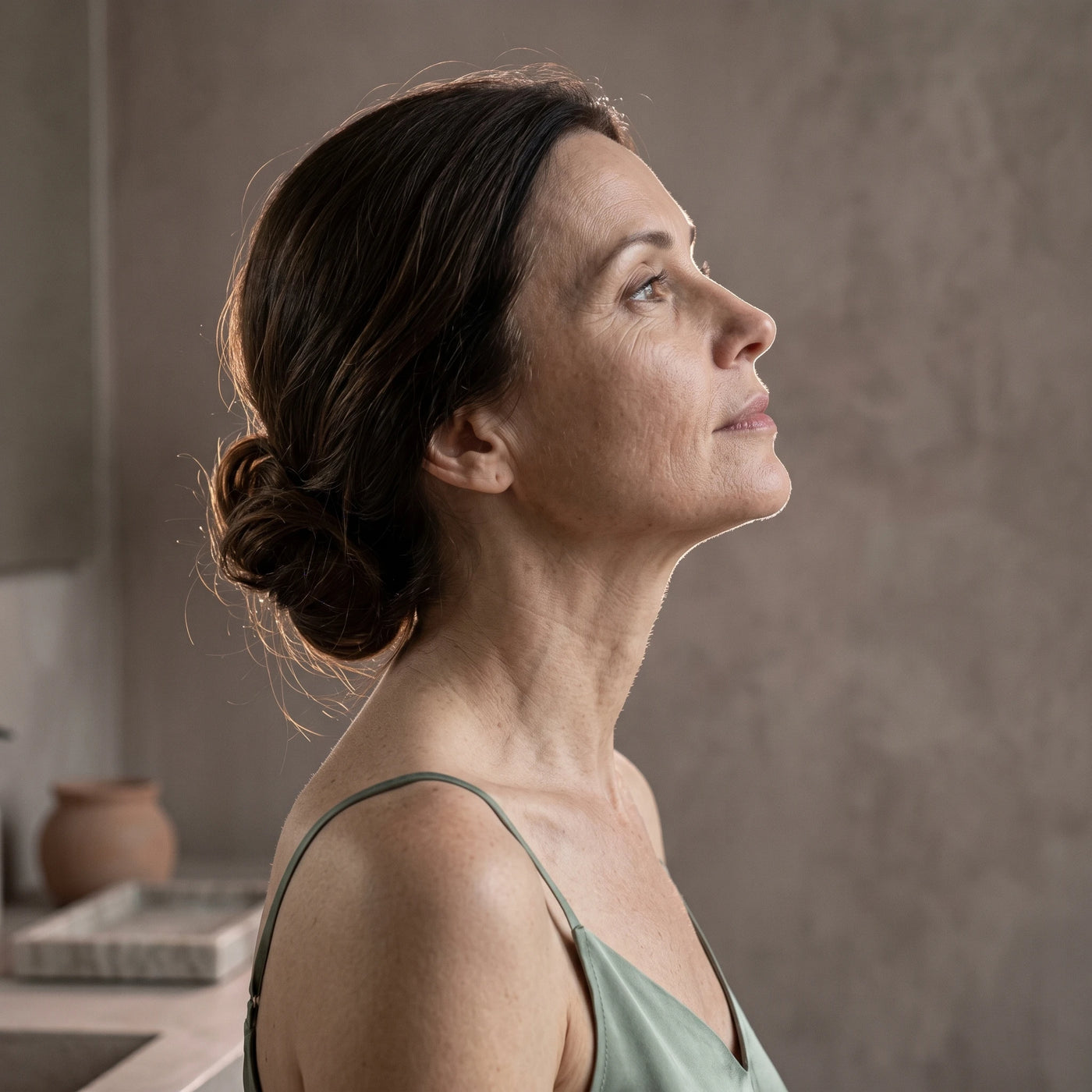 Close up of the ELEVAURE device pushing upward along the jawline using RF heat, demonstrating a non surgical double chin reducer that works for sagging skin.
