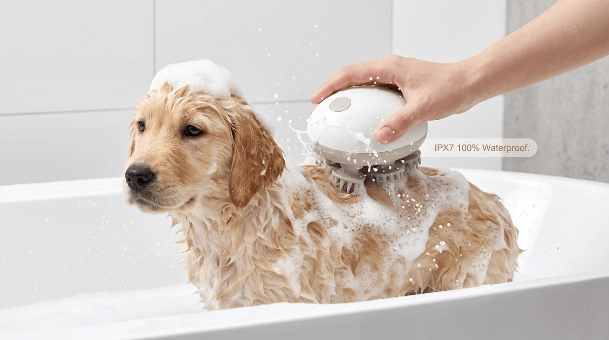 Elevaure electric massager lathering dog shampoo on a wet pet coat during bath time, showcasing IPX7 waterproofing.