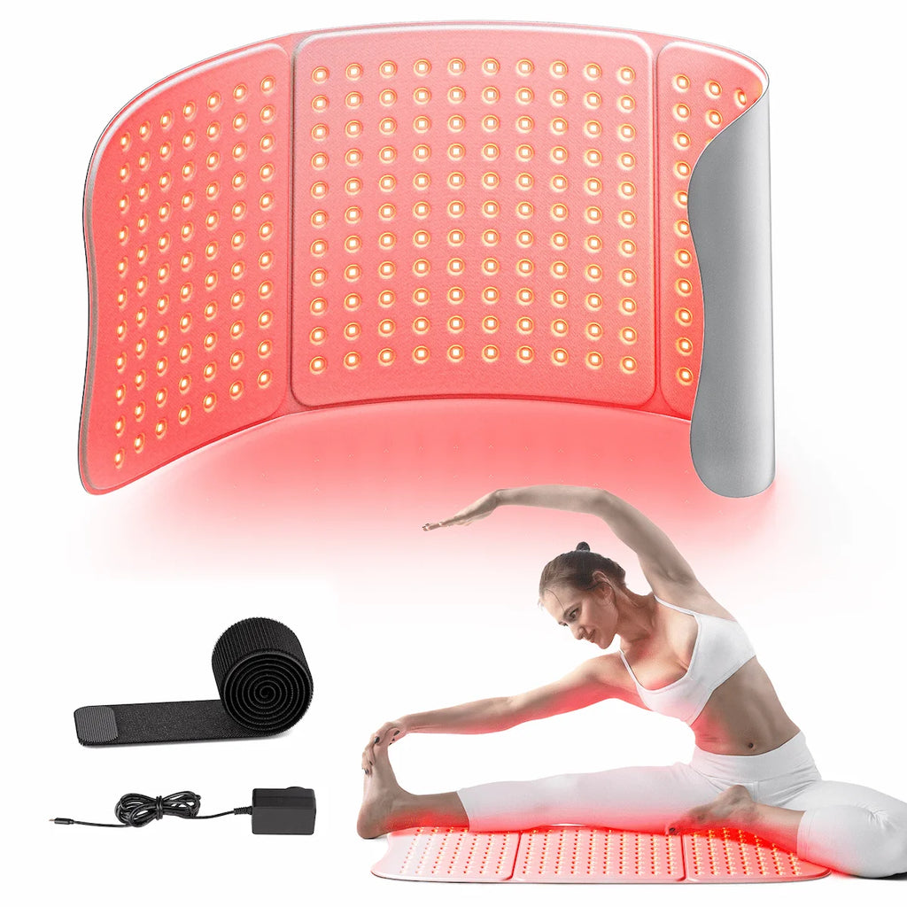 ELEVAURE large red light therapy pad kit showing the dedicated DC 24V adapter and elastic strap, with the pad placed flat under legs during an at-home post-exercise stretching routine.