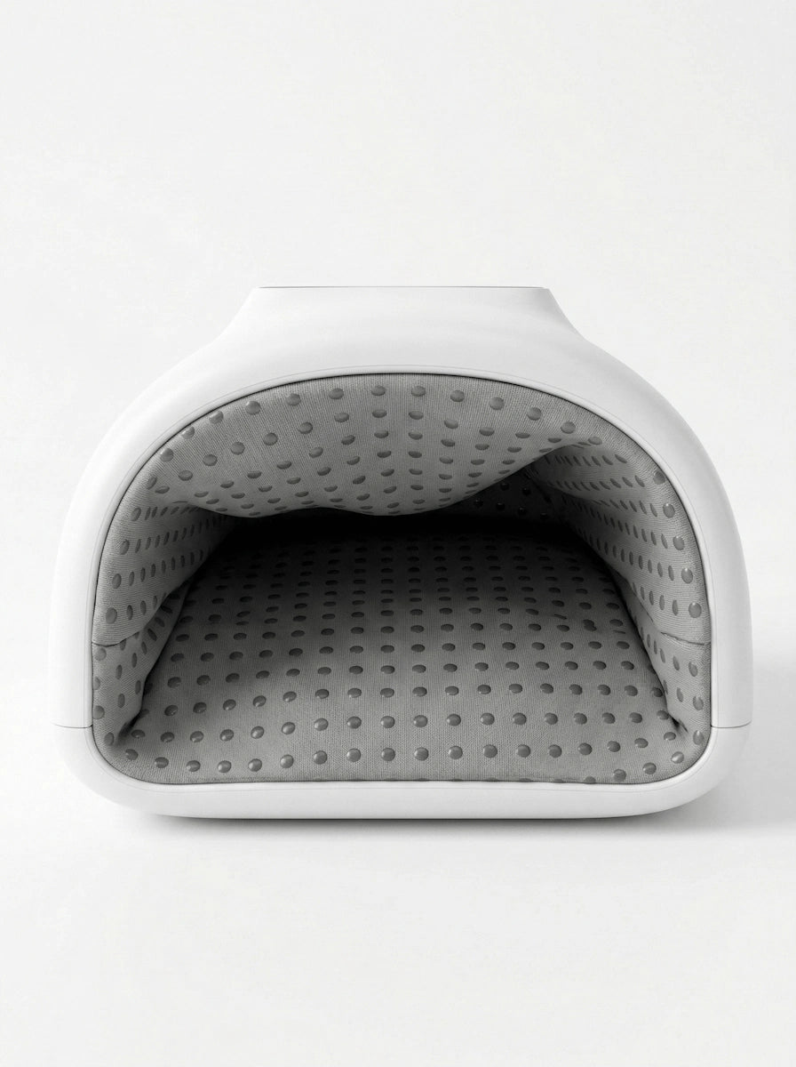 Elevaure hand massager in matte white finish shown diagonally, emphasizing the soft-touch exterior texture and form factor