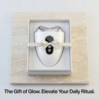 The Elevaure sculptor elegantly displayed inside a premium matte black gift box with a ribbon.
