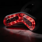 Macro close-up of the ELEVAURE RF device massage head emitting red light therapy for deep collagen stimulation and skin tightening.