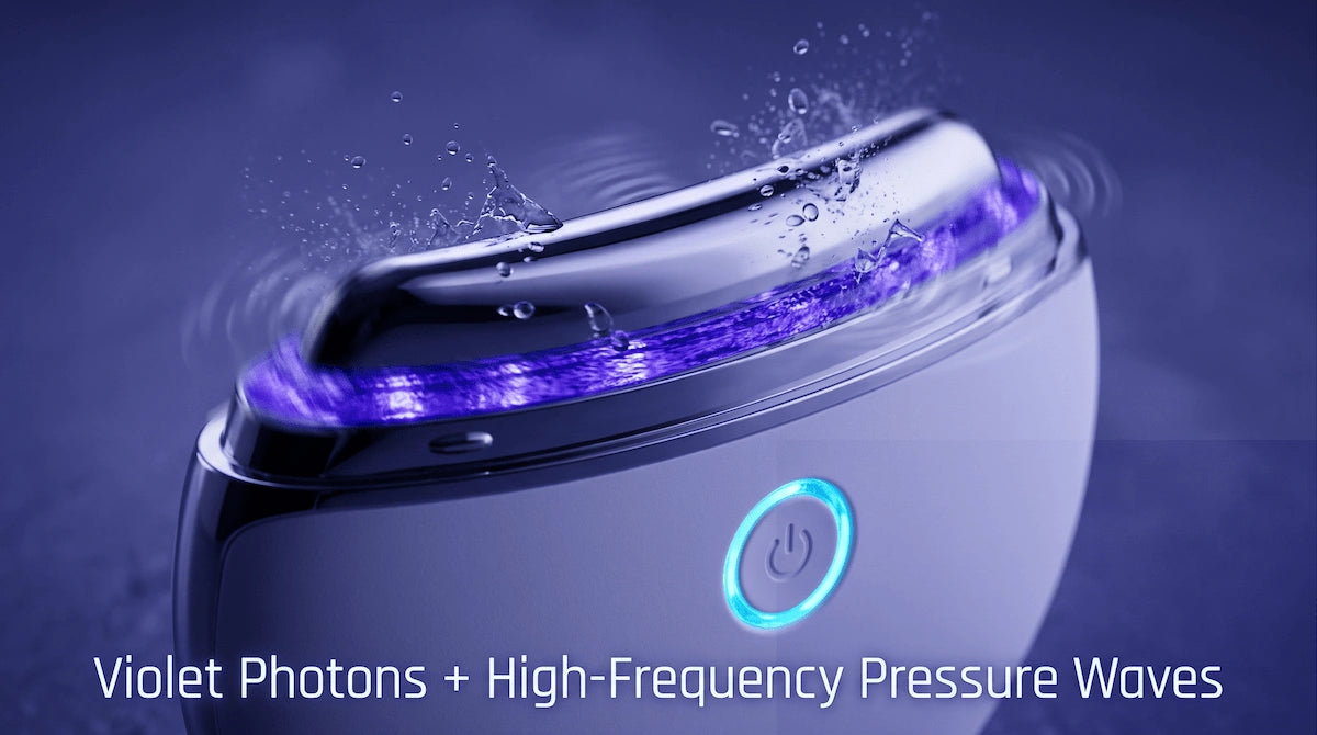 Macro detail of the ELEVAURE massager emitting violet light and high-frequency vibration for lymphatic fluid clearance.